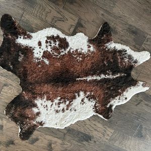 Brown faux cowhide area rug